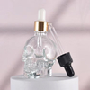 Frasco conta-gotas de vidro de garrafa de óleo essencial de crânio vazio exclusivo de 50ml