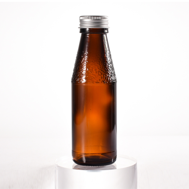 O vidro selado 100ml do fabricante recicla garrafas de xarope de vidro âmbar com tampa de metal